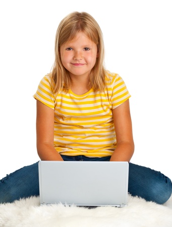 Young girl with laptop isolated on white backgroundの写真素材