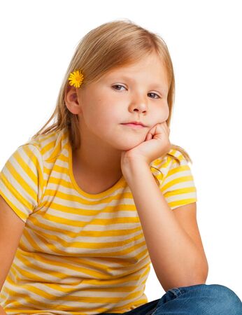 Young girl in yellow shirt isolated on white backgroundの写真素材