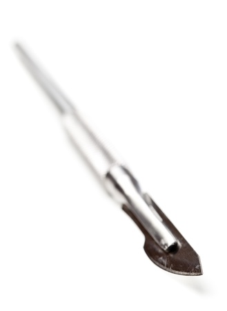 Stainless steel scalpel with selective focus isolated on white backgroundの写真素材