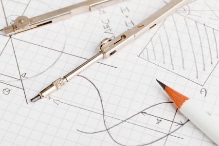 Mathematical notes about geometry and trigonometry with pencil and compass on note paperの写真素材