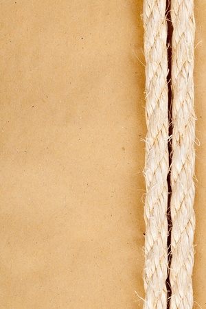 Blank old yellow paper background with manila rope borderの写真素材