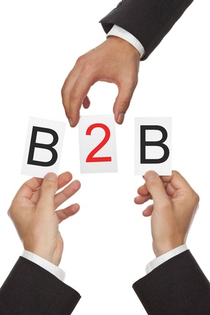 Hands putting the letters for B2B - business to business - togetherの写真素材