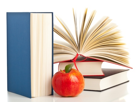 Open book with stack of books with apple - education and nutrition conceptの写真素材