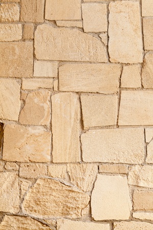 Outside natural limestone brickwall texture close up viewの写真素材