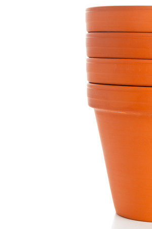 Stacked empty plant pots over white backgroundの写真素材