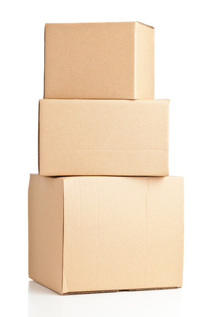 Stacked brown delivery carton boxes on white backgroundの写真素材