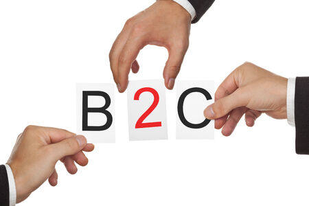 Hands putting the letters for B2C - business to customer - together