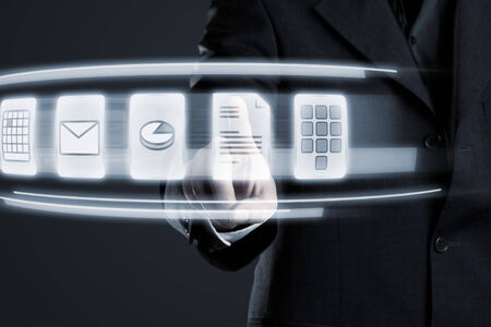 Businessman navigating documents on futuristic touchscreen