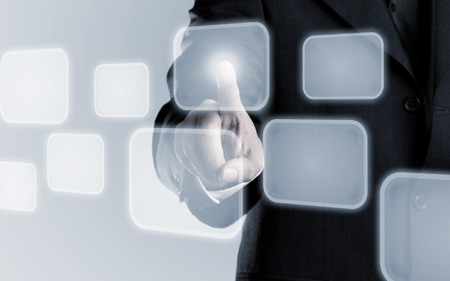Businessman touching infogram graphics on virtual touchscreen with copy space