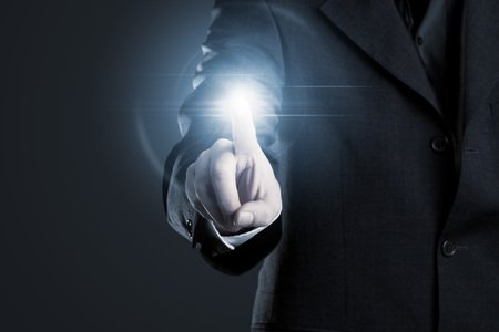 Businessman touching display screen - technology conceptの写真素材