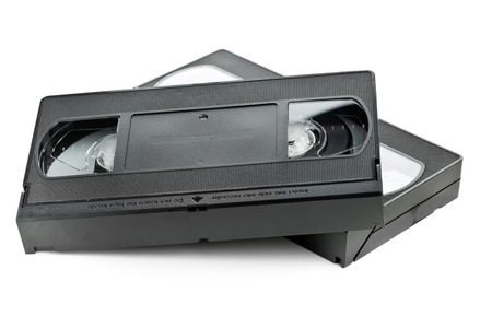 Two analog video home system (VHS) tape over white backgroundの写真素材