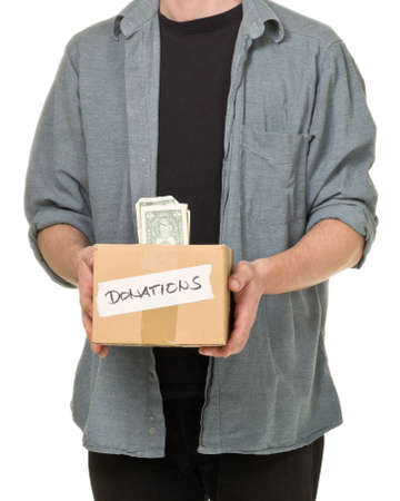 Man holding donation cardboard box with dollar banknotes over white background
