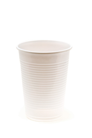 Empty, clean, white plastic cup over white backgroundの写真素材