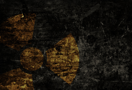Old grunge distressed black metal plate with radiation warning symbol templateの写真素材