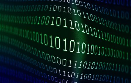 Blue and green colored zeros and ones binary data on computer display screen abstract programming or...
