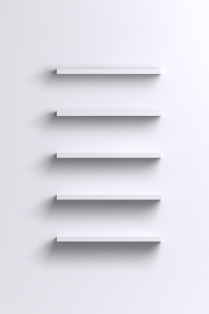 Empty white shelves on blank wall - product advertising or expo backgroundの写真素材