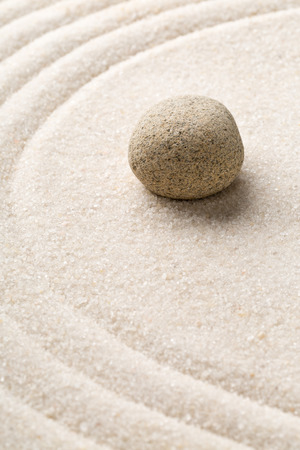 Zen sand and stone garden with raked curved lines with selective focus. Simplicity, concentration or calmness abstract conceptの写真素材