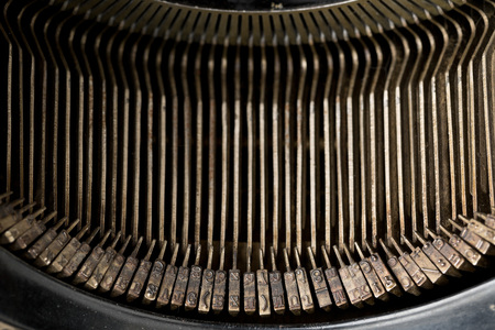 Close up of vintage typewriter letters with selective focus