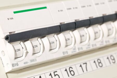 Electric circuit breaker fuse box in private home close up with selective focus