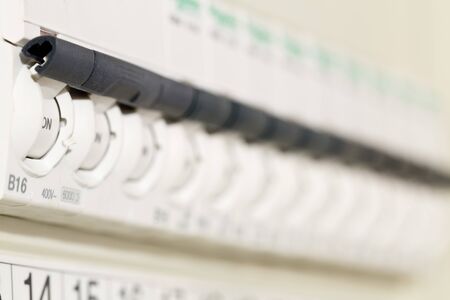 Electric circuit breaker fuse box in private home close up with selective focus