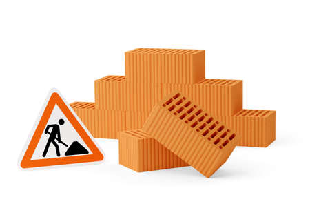 Stack of red brick stones with two single bricks in front and road construction sign over white...