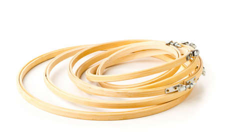 Set of round embroidery or stitching frames over white background with selective focusの写真素材