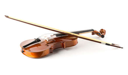 Brown wooden fiddle or violin, classic musical instrument, with bow over white background, selective...