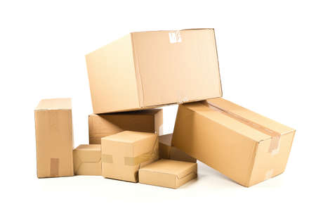 Stack or heap of brown carton cardboard boxes over white background, freight, deilvery or shipping...