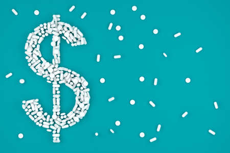 Dollar sign with white pill capsules over blue background - medicine, pharmacy industry or...