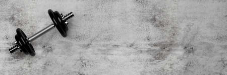 Single fitness gym dumbbell with chrome handle and black plates over concrete floor background flat lay top view from above, muscle exercise, bodybuilding or fitness concept, 3D illustrationの写真素材