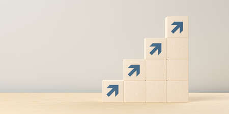 Wooden blocks with arrows on wooden table, business development, progress or career success concept,...