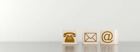 Three wooden blocks with brown phone, letter and e-mail symbol icons on black table, communication concept or contact us banner, 3D illustrationの写真素材