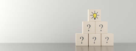 Pyramid of wooden blocks or cubes with question mark symbol icons stacked on wooden table with light bulb symbol on top, faq, question and answer or support concept, 3D illustrationの写真素材