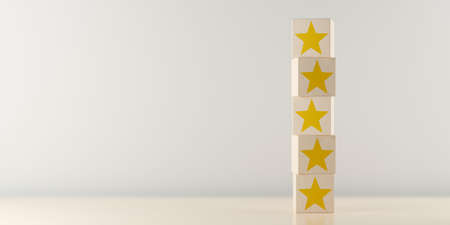 Wooden blocks with yellow stars on table, five star review for best service or product quality...