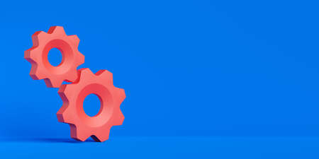 Two red gears or cogwheels on blue background with copy space, modern minimal management, team, process or industry concept template, 3D illustrationの写真素材