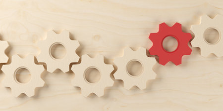 Row of wooden cogwheels or gears with one red on wooden table top view from above, business process, team or teamwork concept, 3D illustrationの写真素材