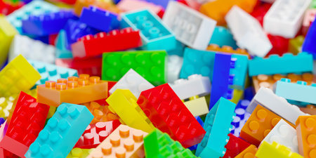 Heap of colorful plastic toy bricks or blocks, childhood or game background, selective focus, 3D illustrationの写真素材