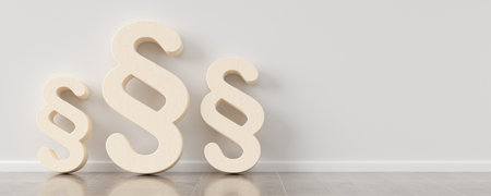 Three wooden paragraph signs standing against wall in room background, legal concept, 3D illustrationの写真素材