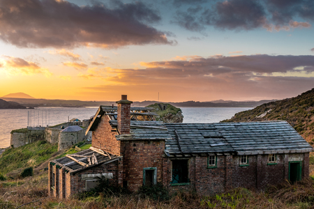 A costal abandoned brick building at sunsetの写真素材