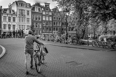 This is a picture of a man Cycling home from shoping in Amsterdamのeditorial素材