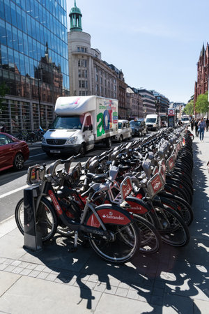 LONDON, UNITED KINGDOM - May 14, 2019: London public bicycles lined up along the side of the street in the City of London.のeditorial素材