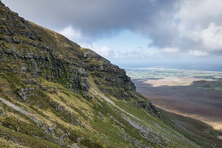 These are the steep wes facing cliffs on top of Muckish mountain in Donegal Irelandの写真素材