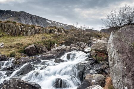 Fast flowing stream at Pont Pen-y-benglog in Snowdonia National Park in Northern Walesの写真素材