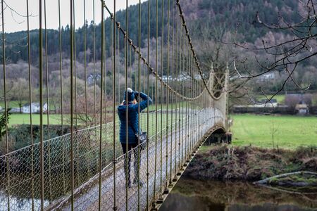 The Sappers Suspension Bridge on the Cownwy river in North Walesの写真素材