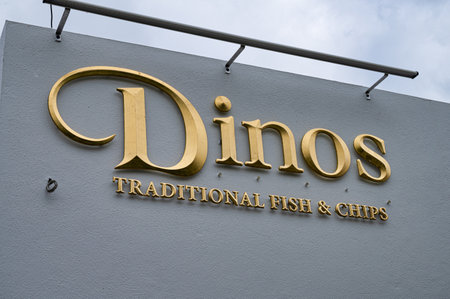 Kinsale, Ireland- July 15, 2021: The sign for Dinos Fish and Chips in Kinsale County Corkのeditorial素材