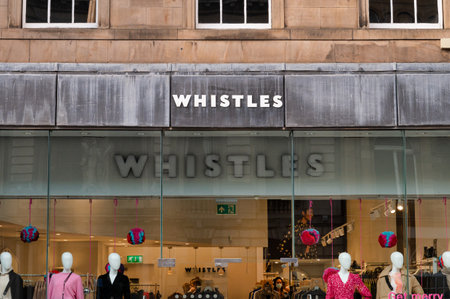 Edinburgh, Scotland- Nov 21, 2021:  The sign for Whistles clothing store in Edinburgh.のeditorial素材