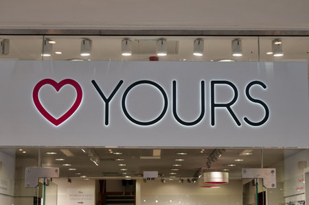 Belfast, UK- Feb 21, 2022:The sign for yours clothing store in Belfast Northern Ireland.のeditorial素材