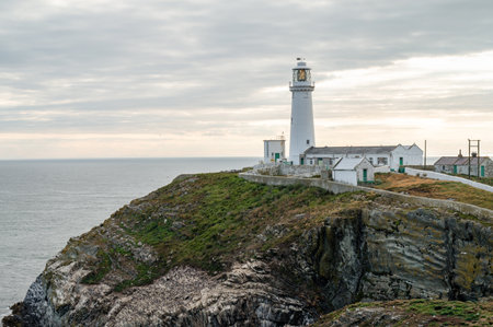 Holyhead, UK- July 7, 2022: West Stack Light house also known as Goleudy Ynys Lawd on Anglesey Island in Walesのeditorial素材