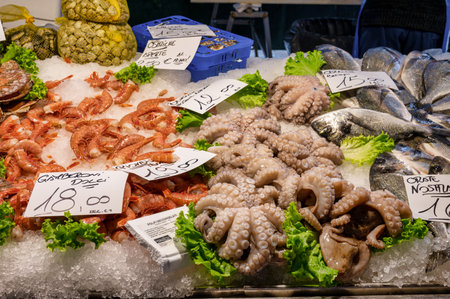 Venice, Italy- Feb 25, 2023: Fresh fish displayed at The Rialto Fish Market in Venice, Italy.のeditorial素材