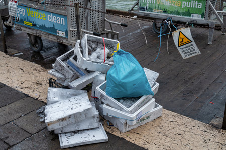 Venice, Italy- Feb 23, 2023: Styrofoam trash next to the Grand Canal in Venice ready to be collected.のeditorial素材